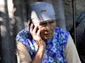 Portrait of senior rural woman talking by phone Royalty Free Stock Photo