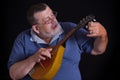 Portrait of a senior tuner with mandolin Royalty Free Stock Photo