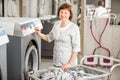 Senior washwoman in the laundry