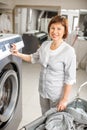 Senior washwoman in the laundry