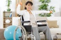 portrait senior woman exercising with dumbbells at home