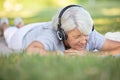 portrait senior woman happy in park with headphone