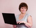 Portrait of senior woman with laptop