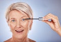 Portrait of senior woman with mascara brush, cosmetic beauty product and makeup wand for eye lashes in Sydney. Surprised Royalty Free Stock Photo
