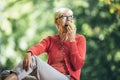 Senior woman at picnic in park eating green apple Royalty Free Stock Photo