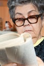 Portrait of senior woman reading book