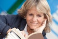 Senior woman reading a book Royalty Free Stock Photo