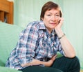 Portrait of senior woman relaxing in couch Royalty Free Stock Photo