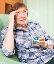 Portrait of senior woman relaxing in couch Royalty Free Stock Photo