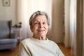 A portrait of a senior woman sitting at home, looking at camera. Royalty Free Stock Photo