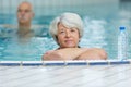 Portrait senior woman in swimming pool