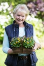 Portrait Of Senior Woman Working In Garden Royalty Free Stock Photo