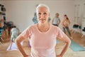 Portrait, senior woman and yoga class, wellness and coach, exercise and healthy lifestyle, workout and fitness studio Royalty Free Stock Photo