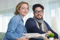 portrait sensible young couple looking at catalogue