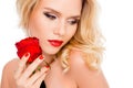 Portrait of sensual attractive woman with red rose in her hand Royalty Free Stock Photo