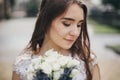 Portrait of sensual bride with wedding bouquet of roses and lavender in stylish gown. Provence wedding. Beautiful bride in stylish Royalty Free Stock Photo