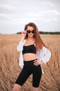 Portrait of sensual brown-haired girl in wheat