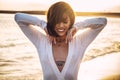 Portrait of sensual happy brunette woman posing on the beach during sunset Royalty Free Stock Photo