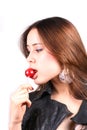 Portrait of sensual pretty woman licks lollipop Royalty Free Stock Photo