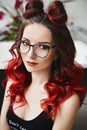Portrait of sensual and hot model girl in bodysuits and fashionable glasses with bright makeup, with red lips and Royalty Free Stock Photo