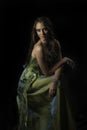 Portrait of sensual woman in green evening dress Royalty Free Stock Photo