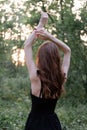 portrait of sensual young woman in a black dress in the forest. freedom, loneliness. nature loving Royalty Free Stock Photo