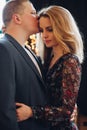 Portrait of sensuality couple kissing and embracing in dark studio.