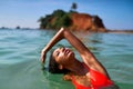 Portrait of serene looking attractive young black female posing in bikini in water. African model posing in the sea Royalty Free Stock Photo