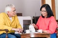 Portrait of serene senior couple enjoying a cup of coffee at hom Royalty Free Stock Photo