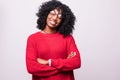 Portrait of a serious african woman with arms folded standing over gray background Royalty Free Stock Photo