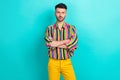 Portrait of serious ambitious confident guy with brunet haircut wear colorful shirt hold arms folded isolated on teal