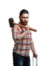 Serious bearded man in cap and checked shirt, holds hammer and chain isolated on white background Royalty Free Stock Photo