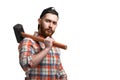 Portrait of serious bearded man in cap and checked shirt, holds sledgehammer on white background Royalty Free Stock Photo