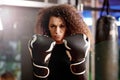 Portrait, serious boxer and woman in gym for exercise, training or workout for healthy body at club. Face, fight and Royalty Free Stock Photo