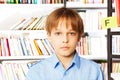 Portrait of serious boy in the library Royalty Free Stock Photo