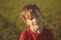 Portrait serious boy in red sweater, Royalty Free Stock Photo