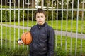 Portrait of serious boy street basket player.