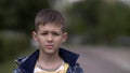 Portrait of a serious boy with a tence glance looking at the camera, close-up heavy face Royalty Free Stock Photo