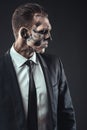 Portrait serious businessman makeup skeleton