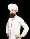 Portrait of a serious chef cook. Bearded chef, cooks or baker. Bearded male chefs isolated on black. Cook hat. Confident Royalty Free Stock Photo