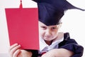 Portrait of serious child girl judge lawyer with red card as s