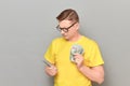 Portrait of serious concentrated mature man counting money Royalty Free Stock Photo