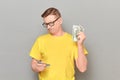 Portrait of serious concentrated mature man counting money Royalty Free Stock Photo