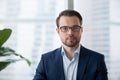 Portrait of serious confident businessman posing in office Royalty Free Stock Photo