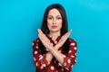 Portrait of serious confident girl with brunette hair wear red shirt holding arms crossed say stop isolated on blue Royalty Free Stock Photo