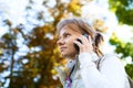 Portrait of serious focused girl speaking by phone Royalty Free Stock Photo