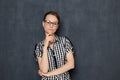 Portrait of serious focused young woman with glasses Royalty Free Stock Photo