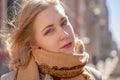 Portrait of serious girl in the autumn on background of City. Fashionable women in scarf and red lipstick looking at camera Royalty Free Stock Photo