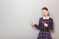 Portrait of serious girl pointing with index fingers at copy space Royalty Free Stock Photo