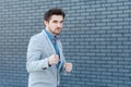 Portrait of serious handsome bearded man in casual style standing in boxing gesture and looking at camera with anger face in Royalty Free Stock Photo